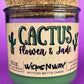 Recycled glass candle jar with green wax and label: Cactus Flower & Jade, WicksNWax