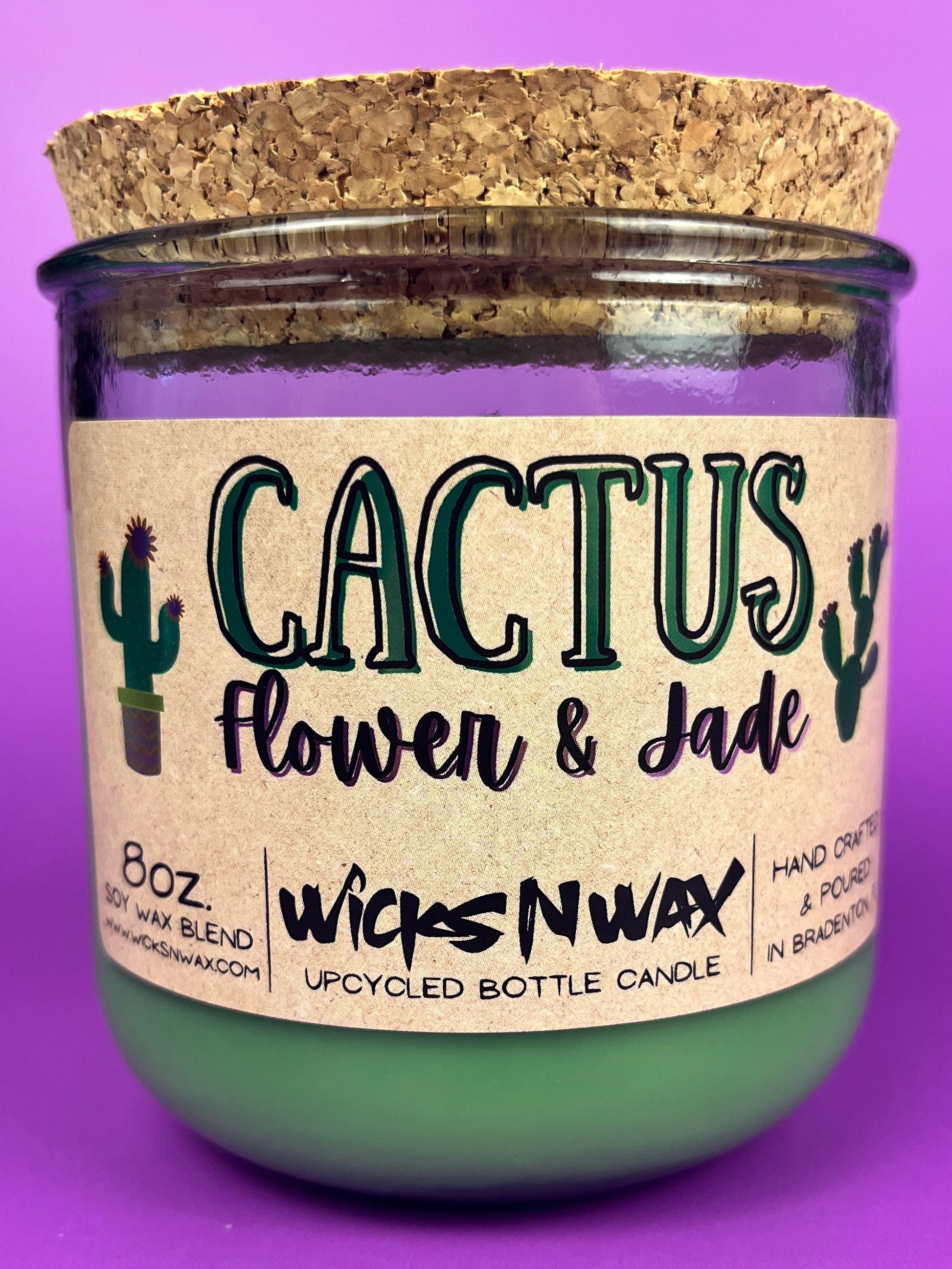 Recycled glass candle jar with green wax and label: Cactus Flower & Jade, WicksNWax
