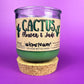 Recycled glass candle jar with printed label, green wax, and tan cork base
