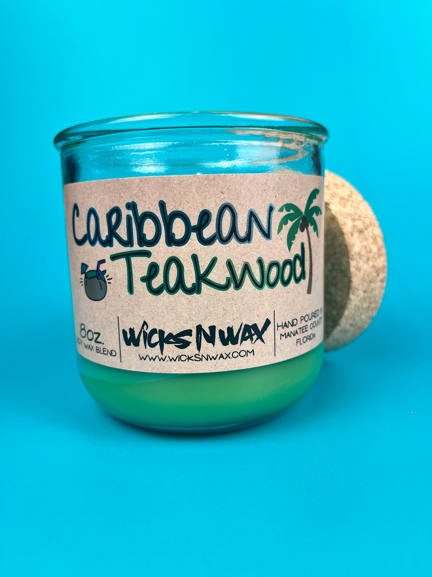 Recycled glass candle with green wax, cork base and lid edge, Caribbean Teakwood label