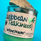Recycled glass candle with green wax, speckled cork lid, Caribbean Teakwood label detail