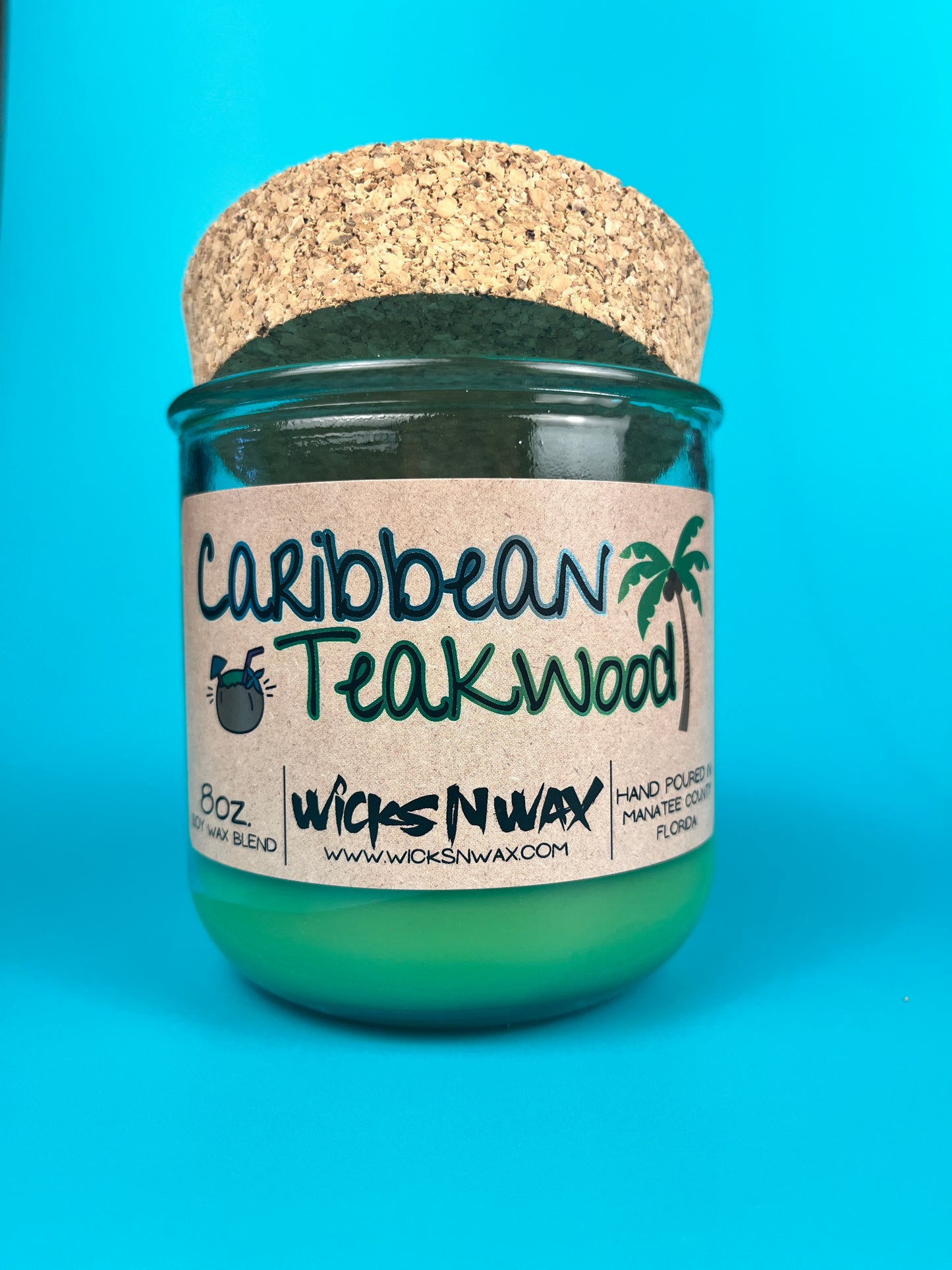 Recycled glass candle with green wax, speckled cork lid, Caribbean Teakwood label, WicksNWax