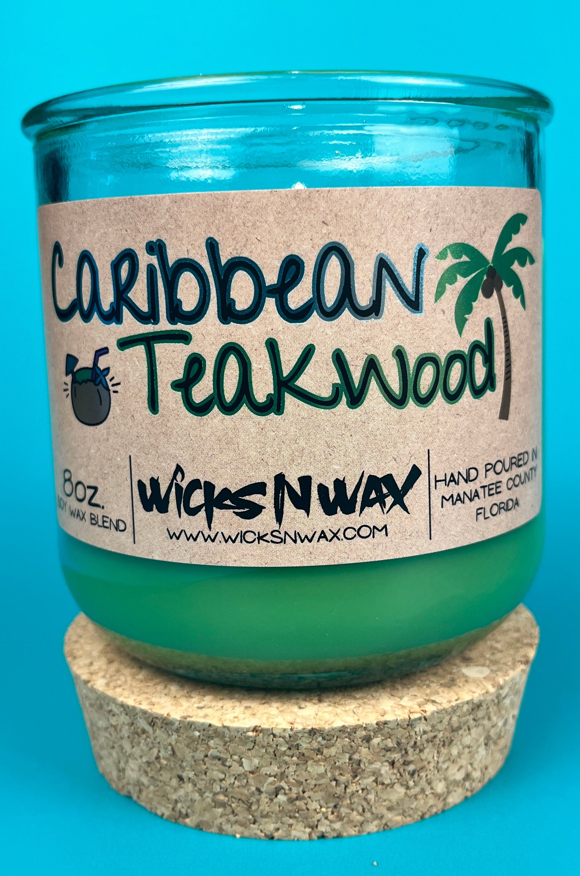 Recycled glass candle with green wax, cork lid ring, Caribbean Teakwood label, WicksNWax