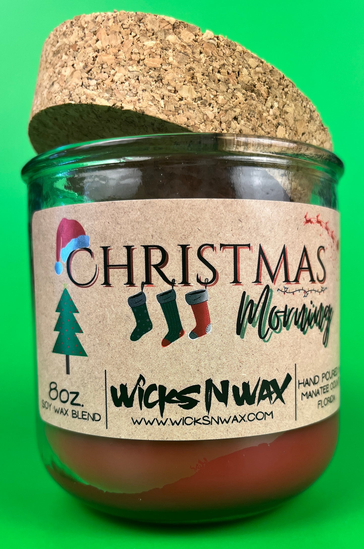 Christmas Morning recycled glass candle in green jar with cork lid and front label