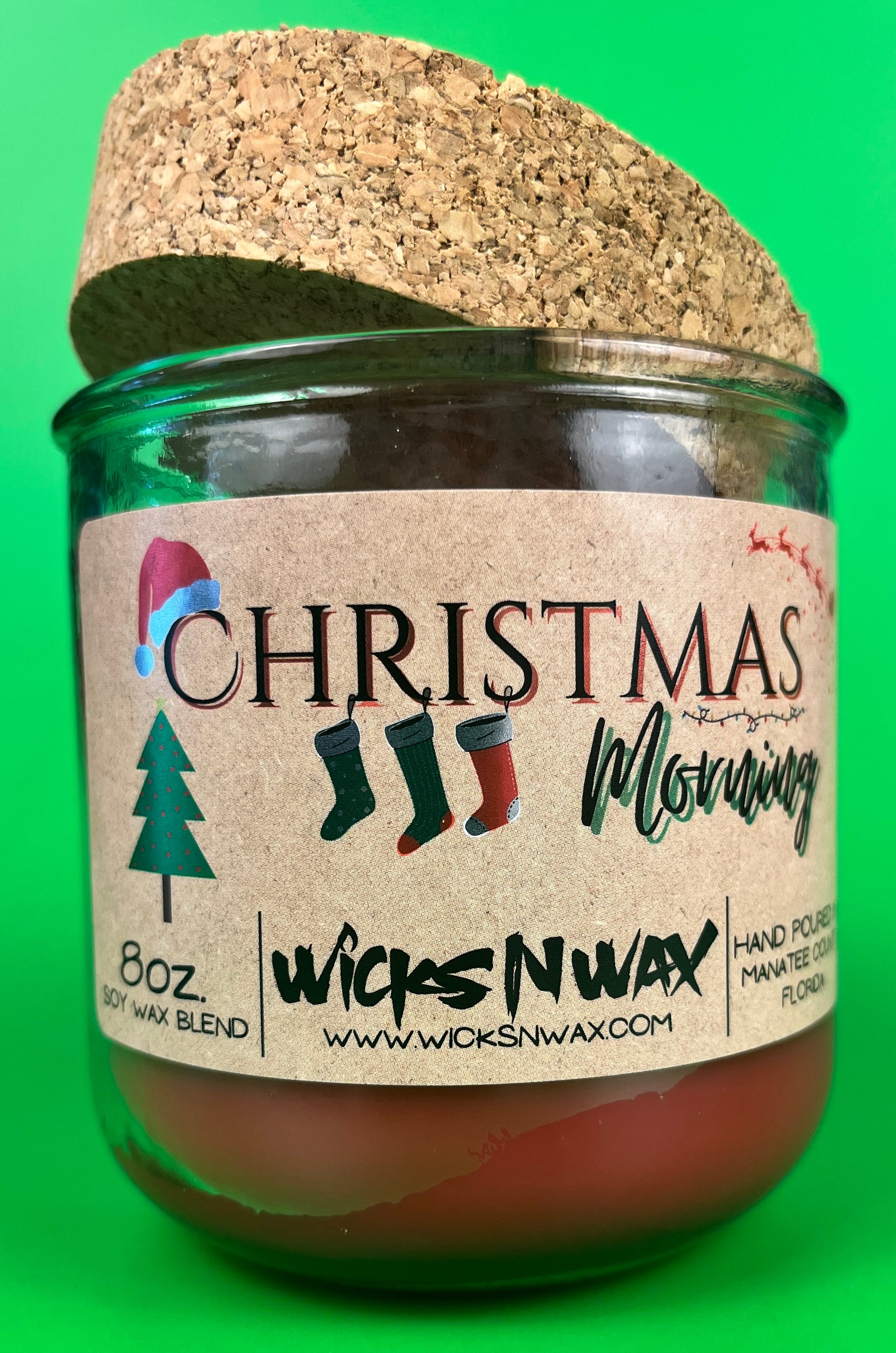 Christmas Morning recycled glass candle in green jar with cork lid and front label
