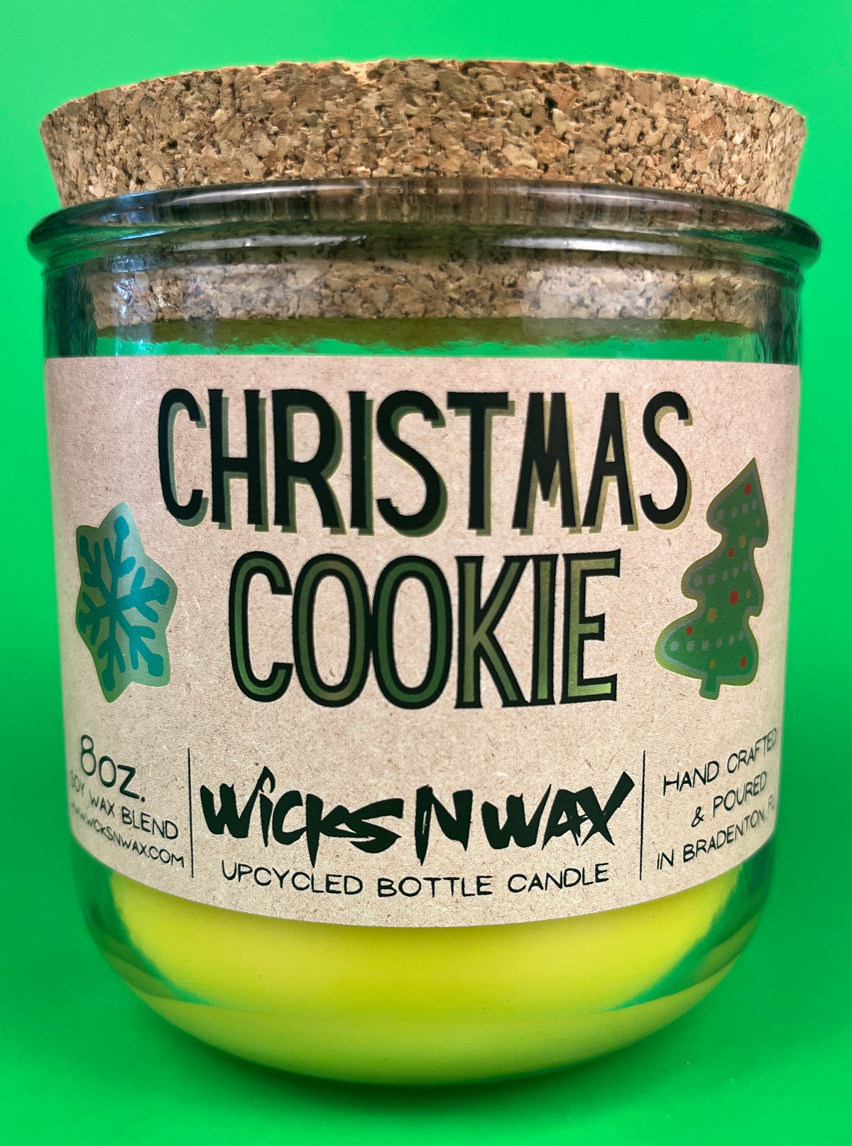 Christmas Cookie recycled-glass candle, green jar with cork lid and bright yellow wax