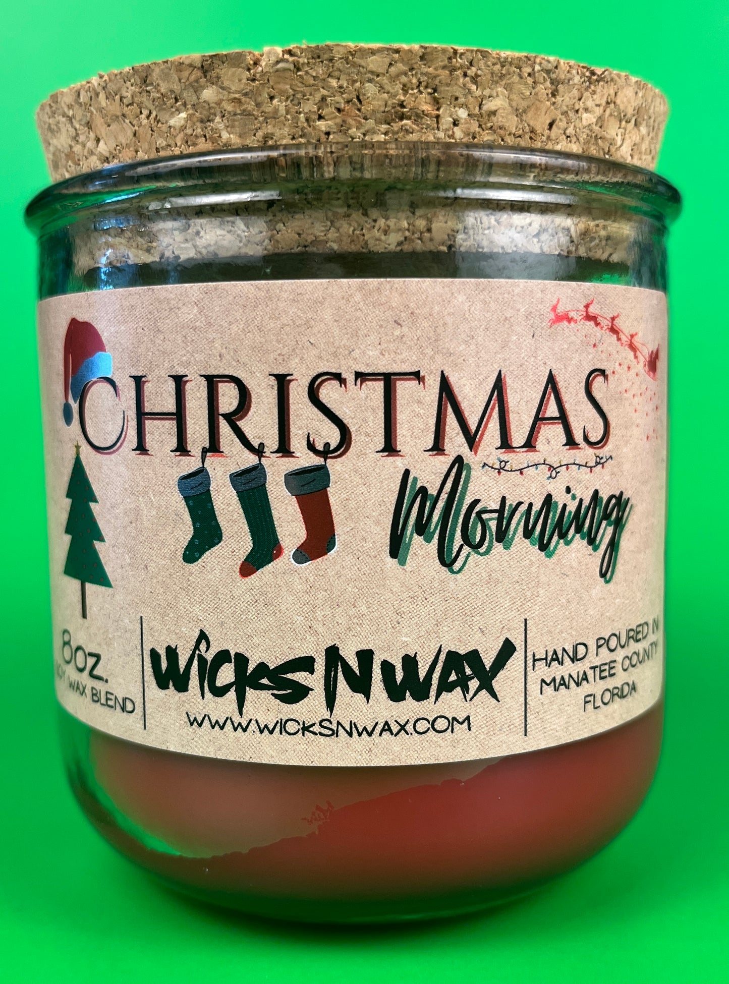 Christmas Morning recycled glass candle in green jar with full front label on wax