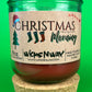 Christmas Morning recycled glass candle with front label and green glass jar, on cork base