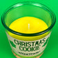 Christmas Cookie recycled-glass candle, open green jar showing yellow wax and wick