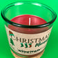 Christmas Morning recycled glass candle in green-tinted jar with centered wick