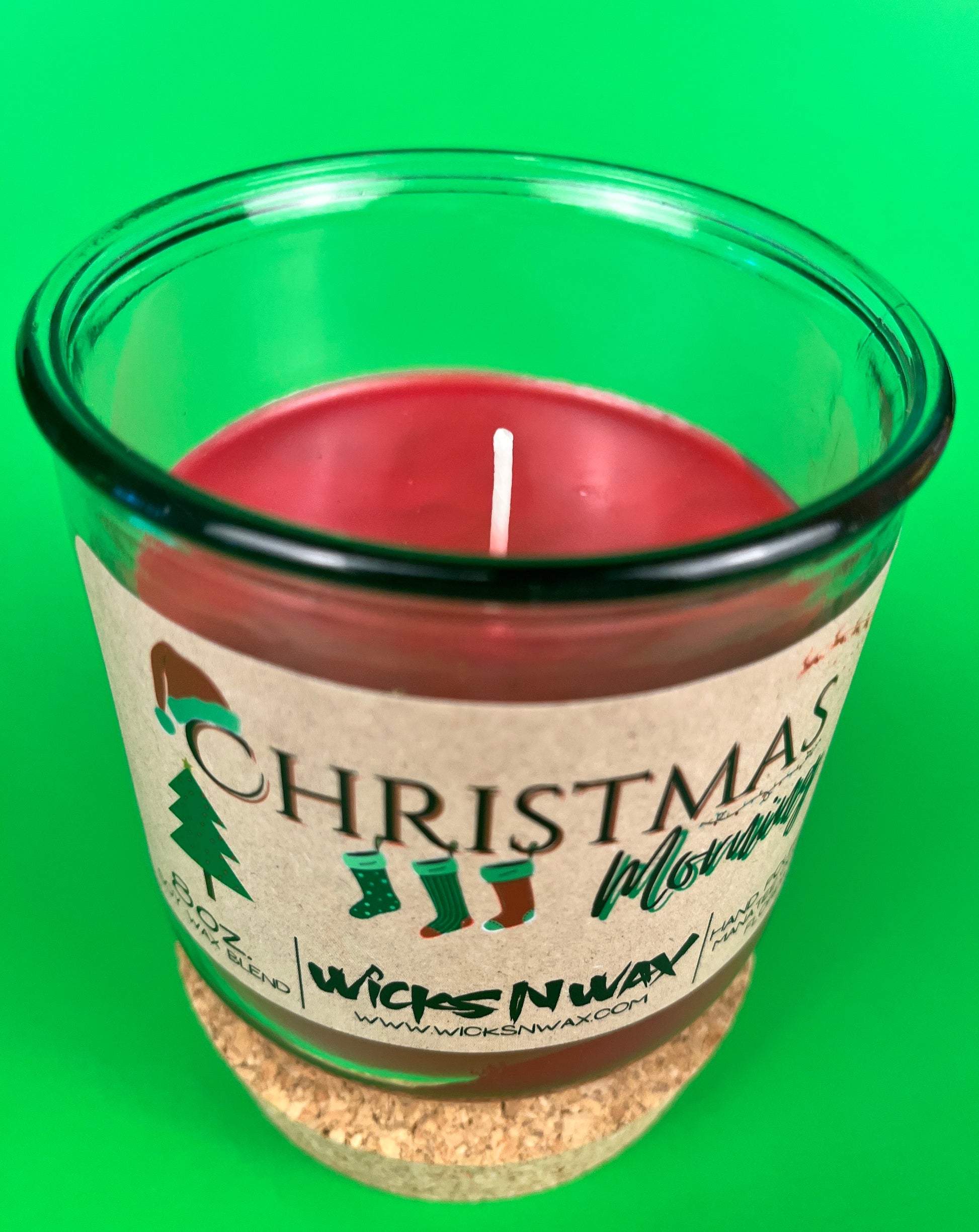 Christmas Morning recycled glass candle in green-tinted jar with centered wick
