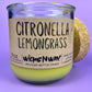 Recycled glass candle with green wax and “Citronella Lemongrass” label, side view