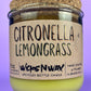 Recycled glass candle with green wax and “Citronella Lemongrass” label, cork base