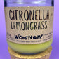 Recycled glass candle with green wax and “Citronella Lemongrass” label, cork base