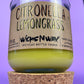 Recycled glass candle with green wax, cork lid, and “Citronella Lemongrass” label