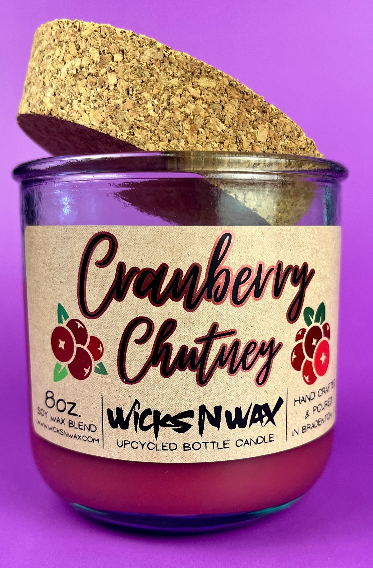 Recycled glass bottle candle with cork lid, magenta wax, Cranberry Chutney label centered