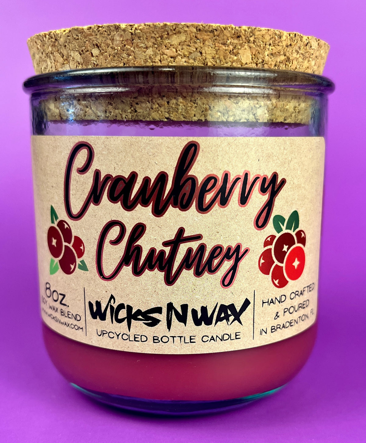 Recycled glass bottle candle with cork lid, magenta wax, Cranberry Chutney label on front