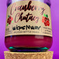 Recycled glass candle jar with Cranberry Chutney label, purple glass