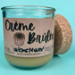 WicksNWax recycled glass candle in teal jar with Creme Brûlée label