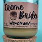 Recycled glass candle with creamy wax, kraft label and WicksNWax branding on jar