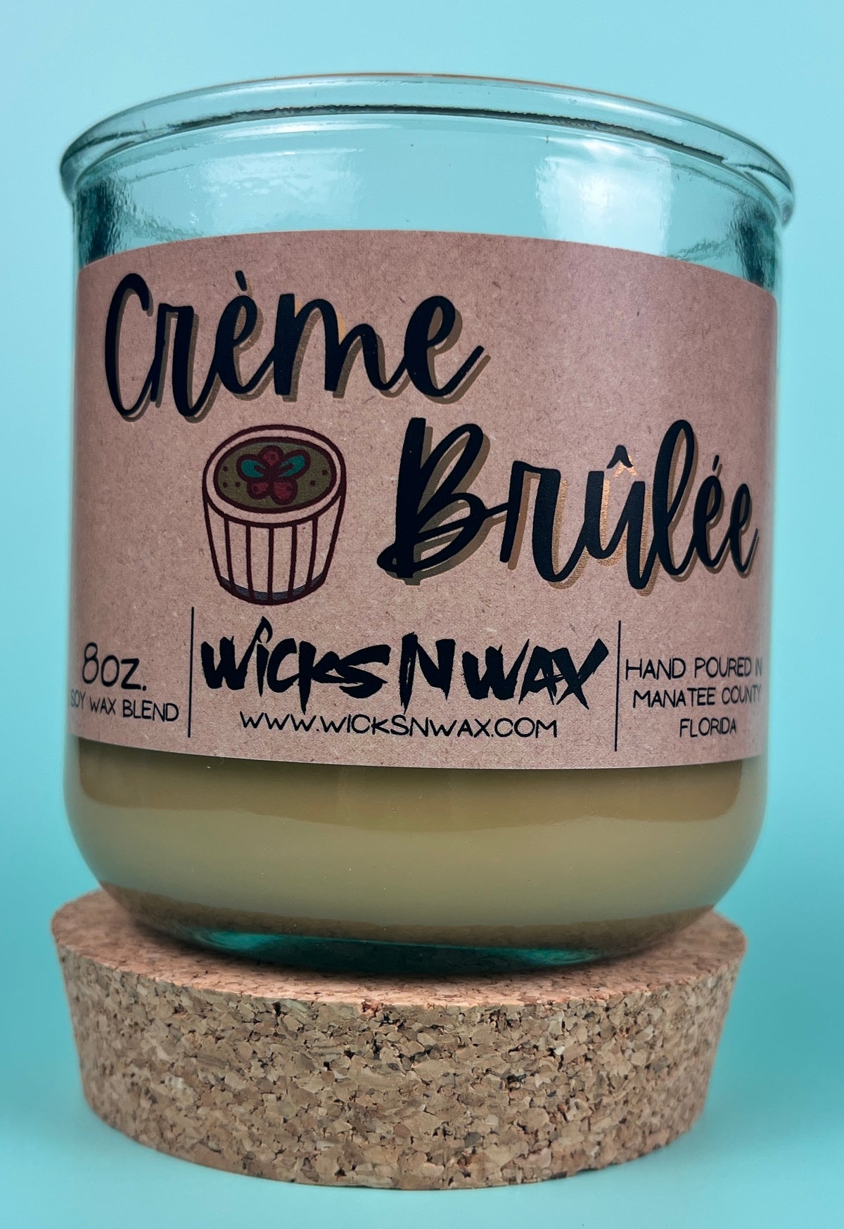 Recycled glass candle with creamy wax, kraft label and WicksNWax branding on jar