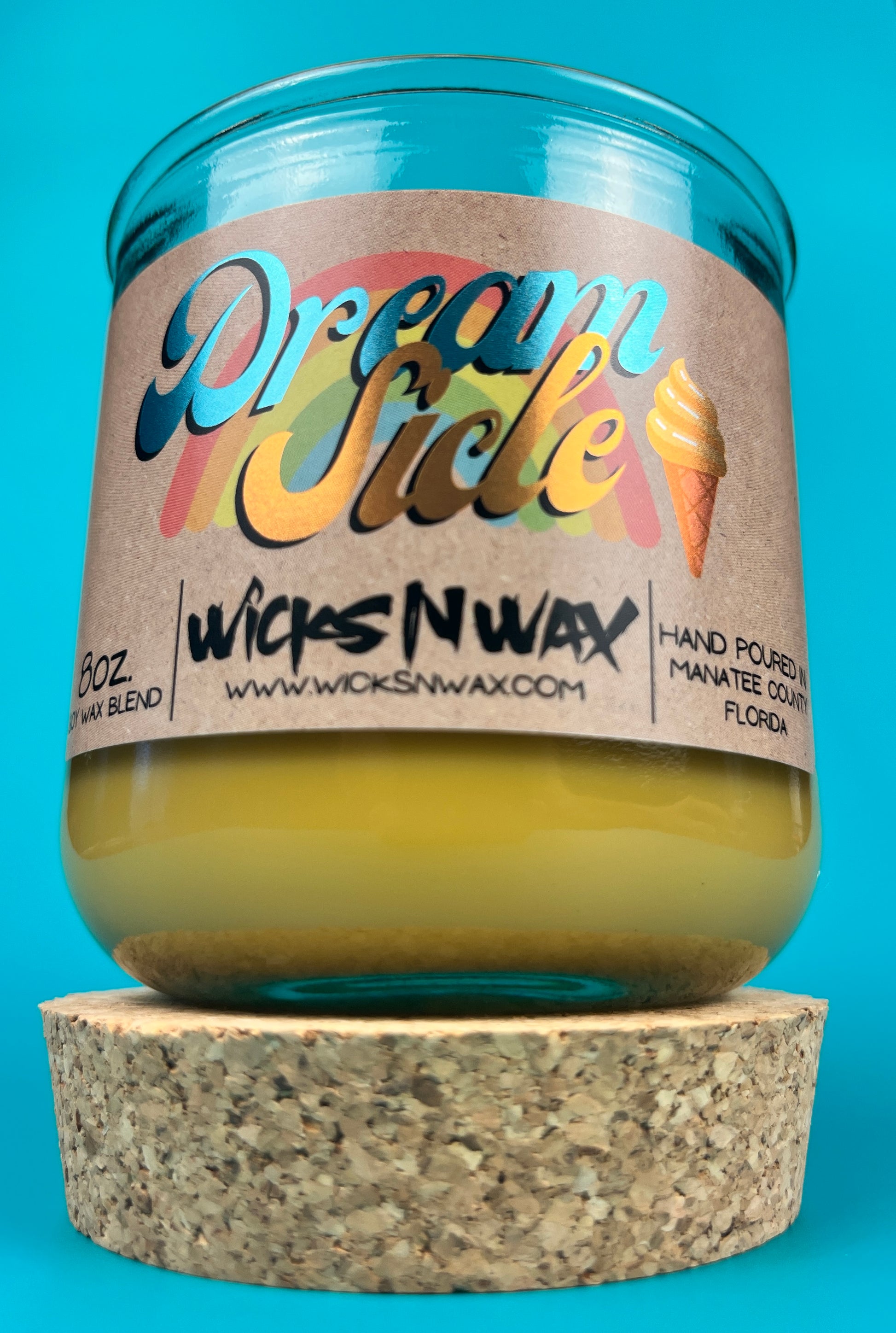 Recycled glass candle jar on cork base, yellow wax, printed label and wick