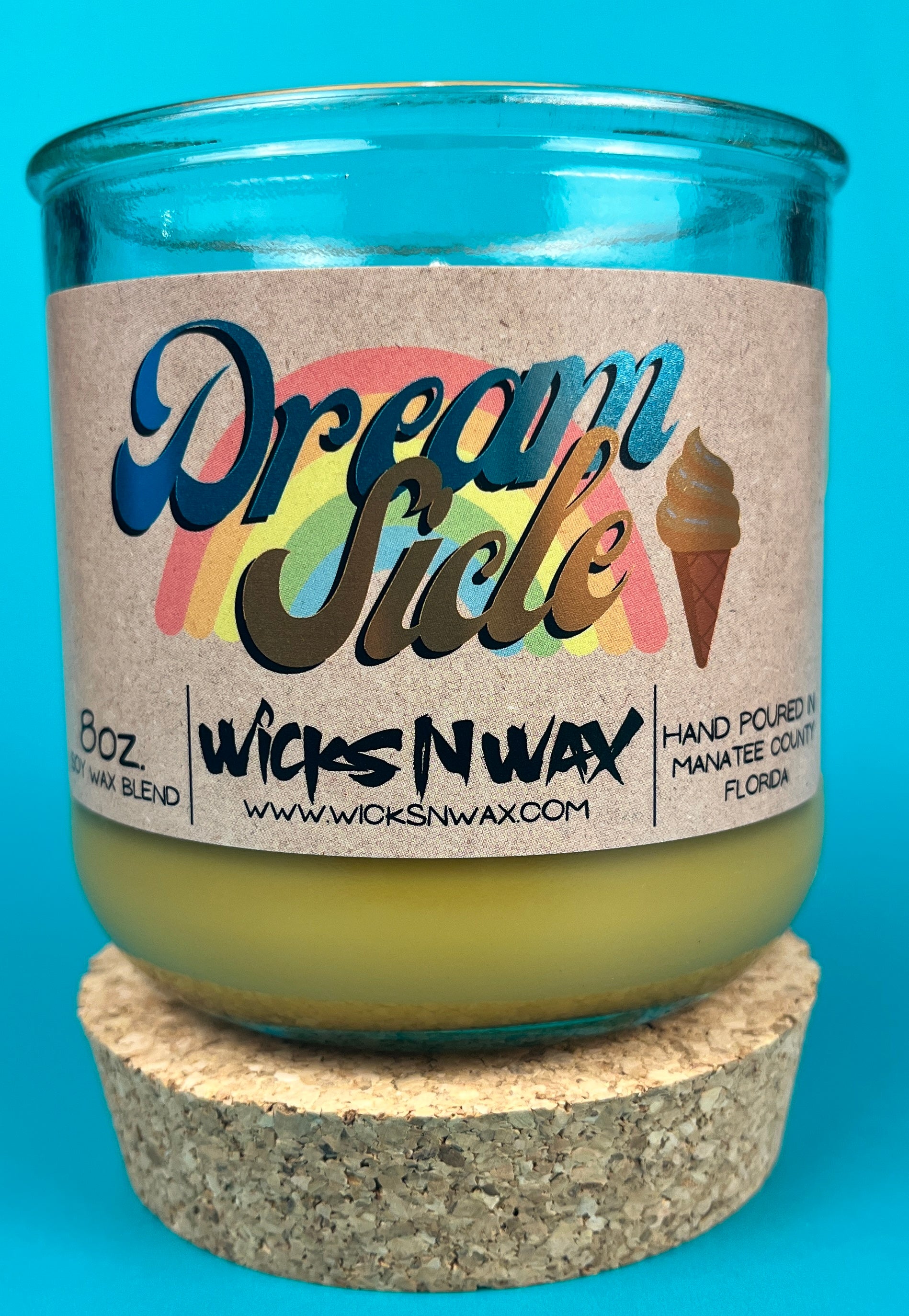 Recycled glass candle jar with cork base, yellow-green wax, printed label
