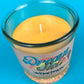 Recycled glass candle jar with cork base, yellow wax pool and centered wick