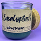Eucalyptus recycled glass candle close-up, dark green wax in clear jar and cork lid