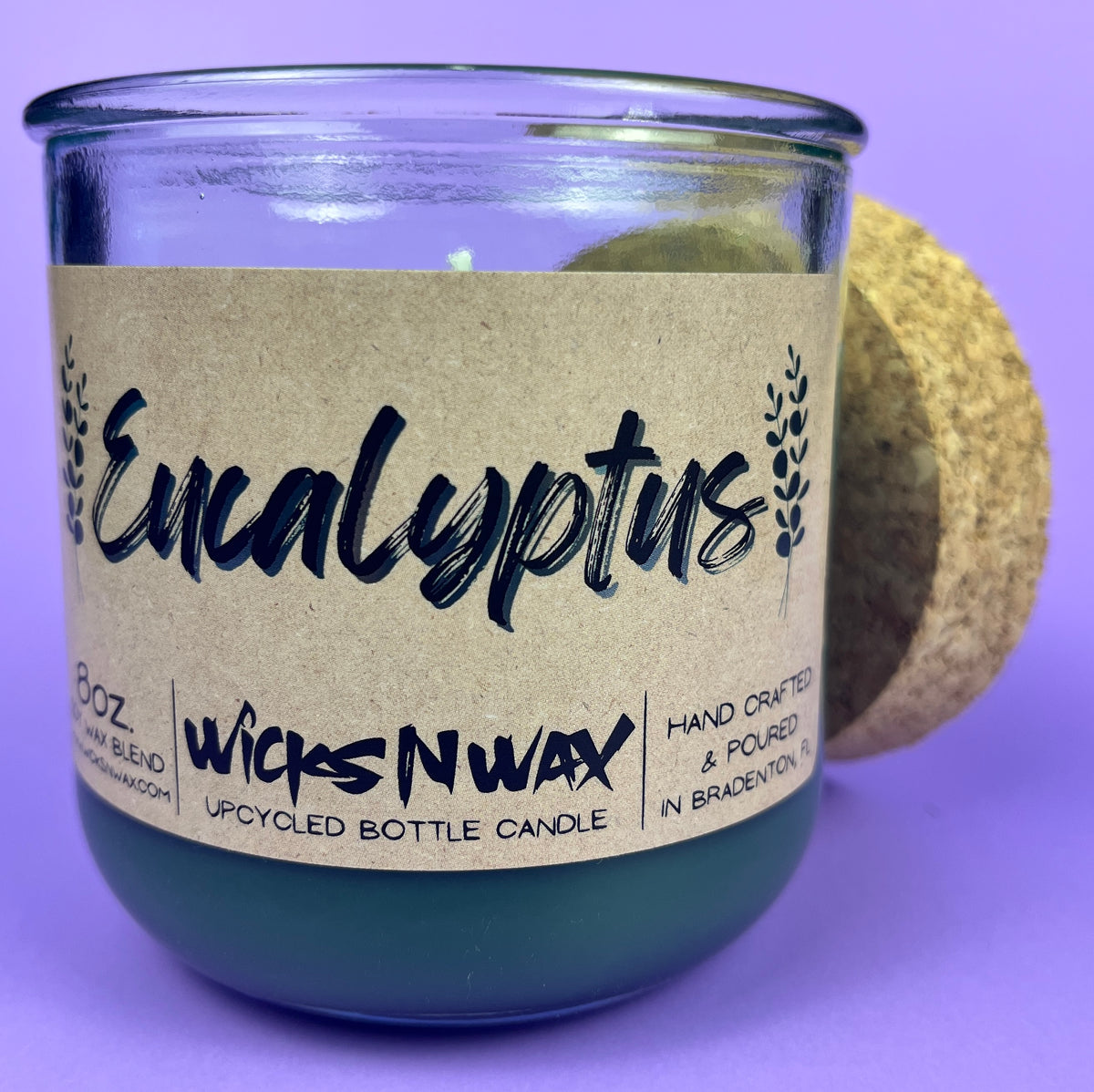 Eucalyptus recycled glass candle with cork lid; WicksNWax label; dark green wax