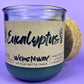 Eucalyptus recycled glass candle close-up, dark green wax in clear jar