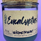 Eucalyptus recycled glass candle front view, dark green wax in clear jar with cork lid