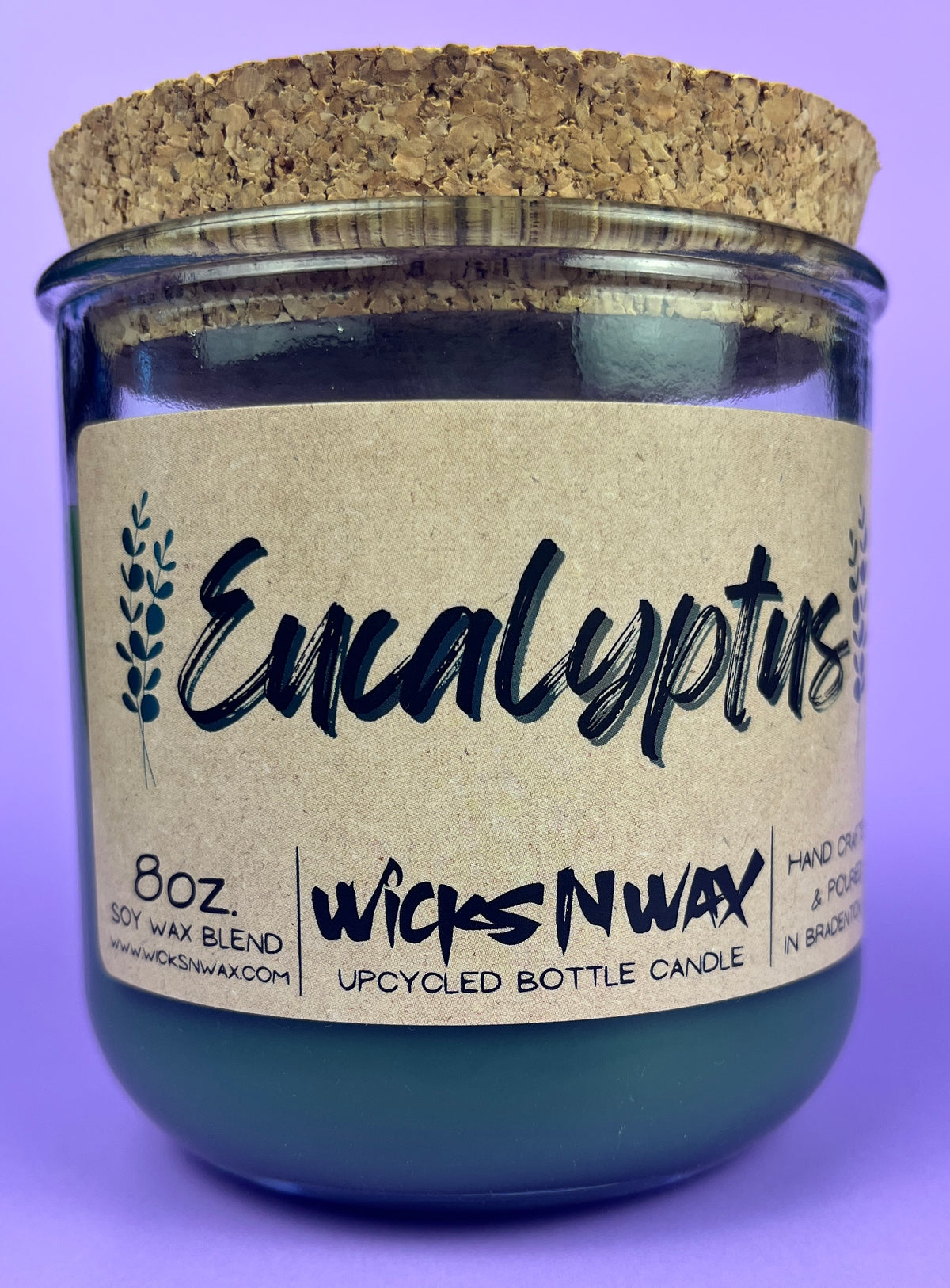 Eucalyptus recycled glass candle with cork lid; centered WicksNWax label; dark wax