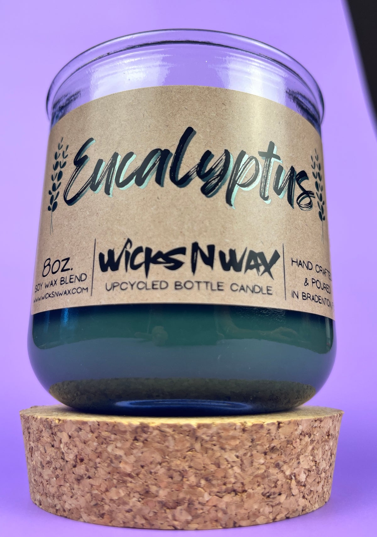 Eucalyptus recycled glass candle, dark green wax in clear jar with cork base