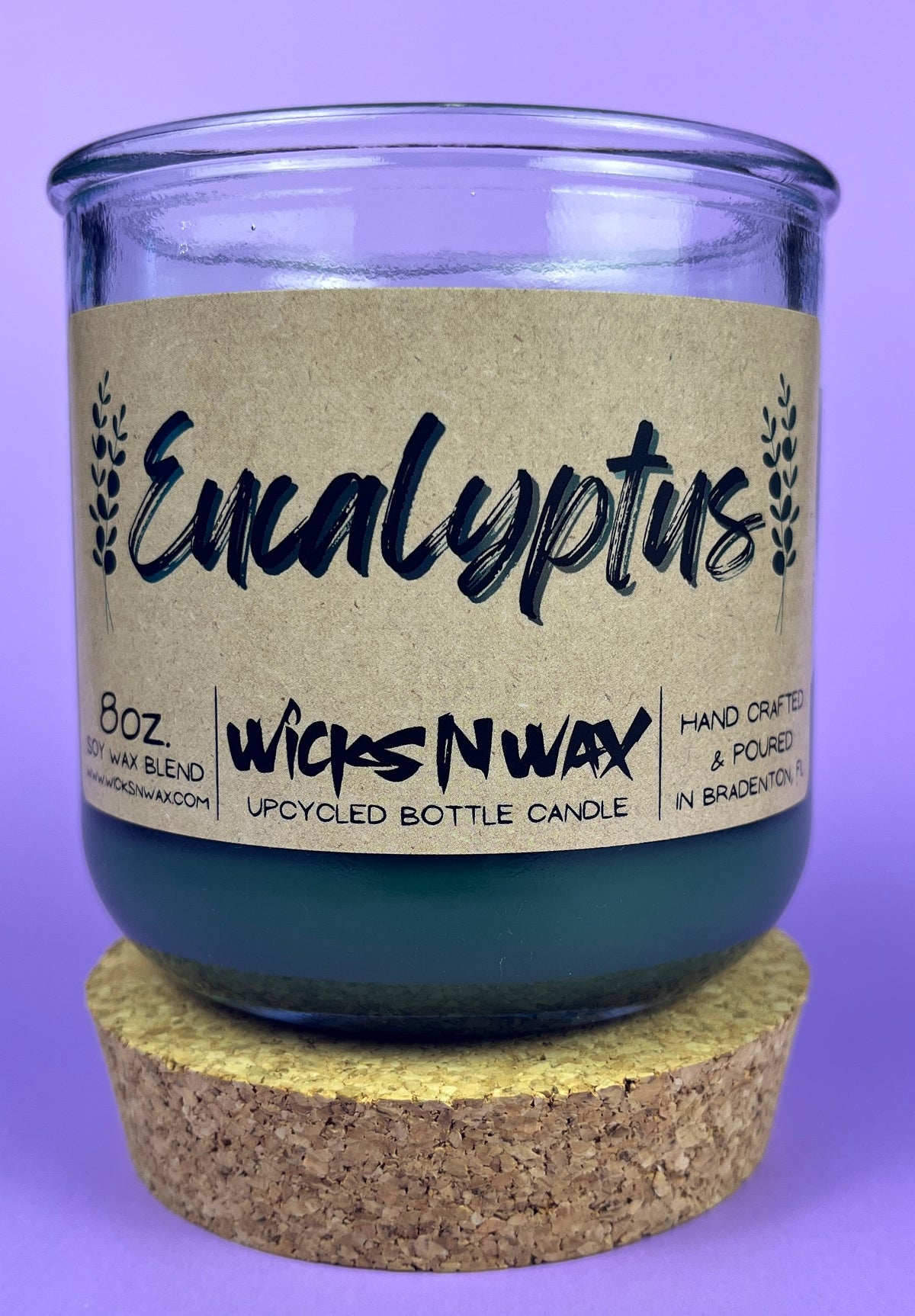 Eucalyptus recycled glass candle, dark green wax in clear jar with cork base