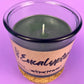 Eucalyptus recycled glass candle with wick visible; WicksNWax label; dark green glass