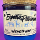 Blue glass candle jar with cream label and illustrated figures, cork base and label visible