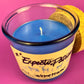 Recycled glass candle in blue jar with white wick and yellow graphic label