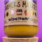 Glass candle jar with Farmers Market label and amber wax, cork base at bottom