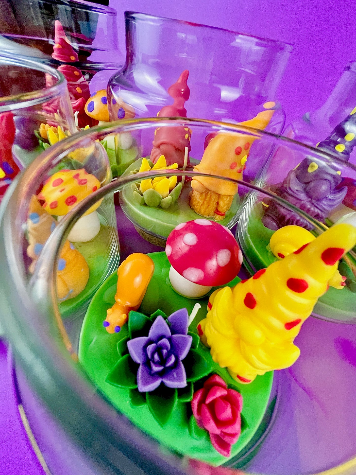 Garden gnome candle: colorful wax figures with red mushroom and flower details