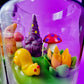 Garden gnome art candle in clear glass jar with green wax and mushroom and gnome figures