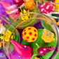 Garden gnome art candle in clear jar with colorful wax shapes on green wax base