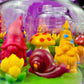 Garden gnome candle: red gnome, yellow mushroom and yellow gnome on green wax