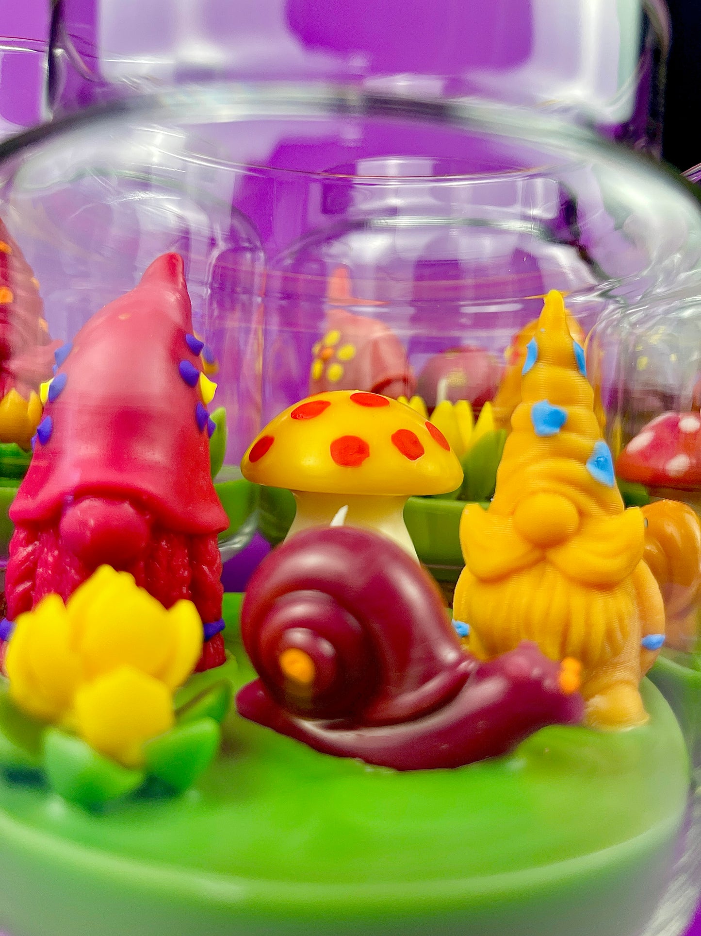 Garden gnome candle: red gnome, yellow mushroom and yellow gnome on green wax