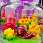 Garden gnome candle: red gnome, yellow mushroom, snail and green wax base