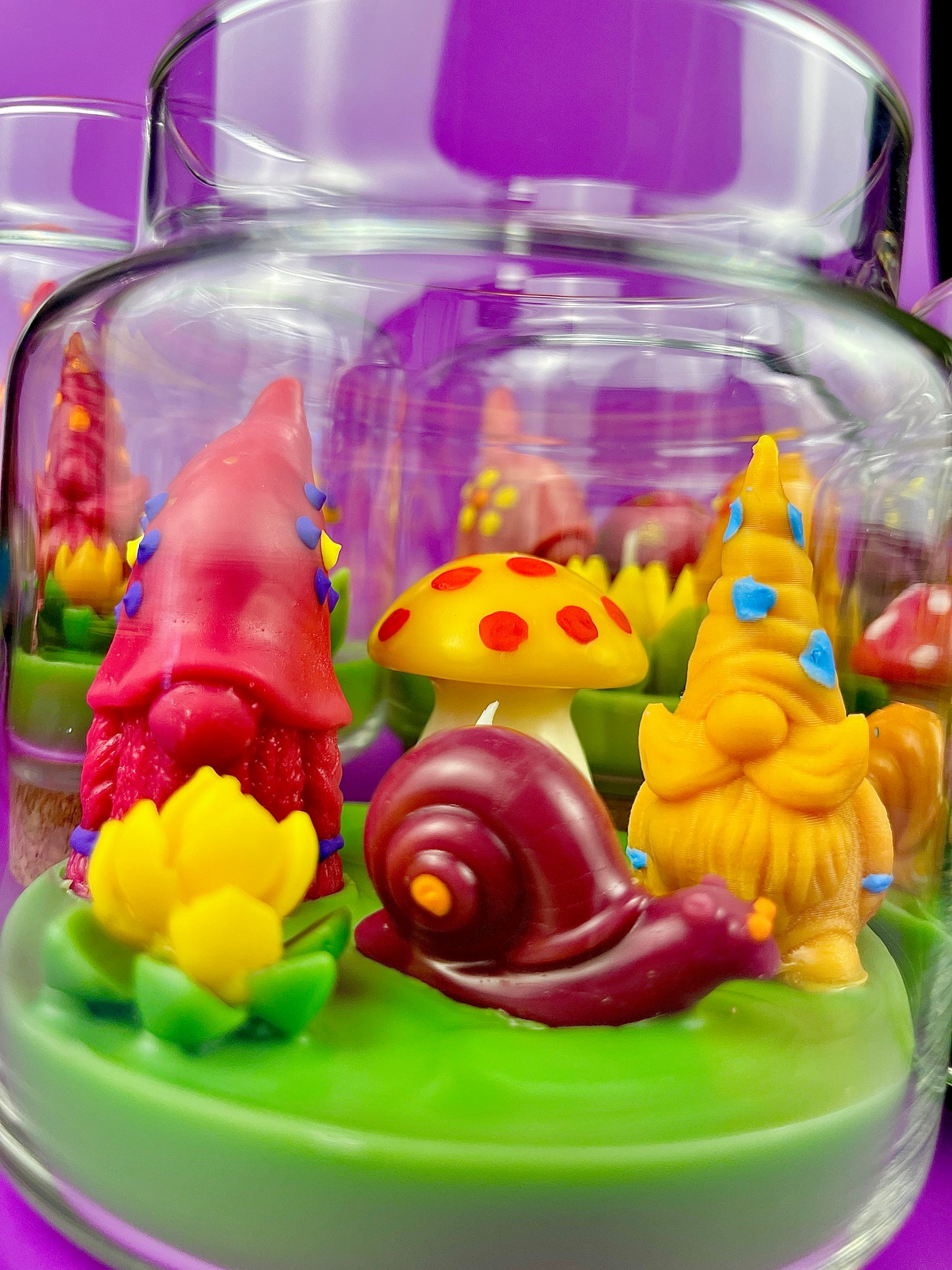 Garden gnome candle: red gnome, yellow mushroom, snail and green wax base