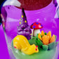 Garden gnome candle: purple gnome, red polka mushroom and green wax pond