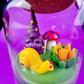 Garden gnome candle: purple gnome, red polka mushroom and colorful wax flowers