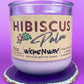 Recycled glass candle in purple jar on cork base with Hibiscus label