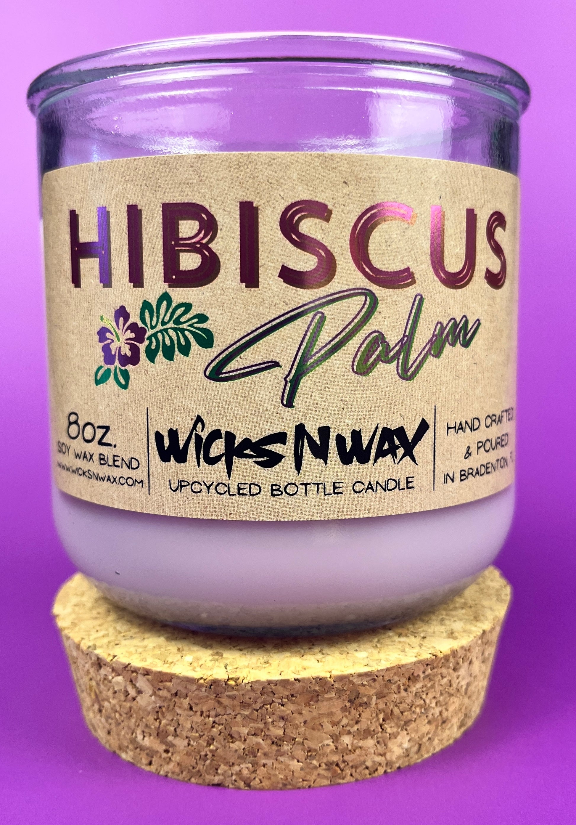 Recycled glass candle in purple jar with cork coaster and Hibiscus label